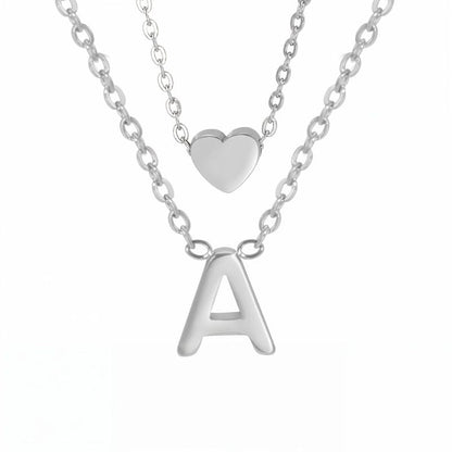 Collier double avec pendentif cœur et initiale personnalisée