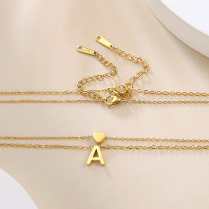 Collier double avec pendentif cœur et initiale personnalisée