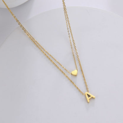 Collier double avec pendentif cœur et initiale personnalisée