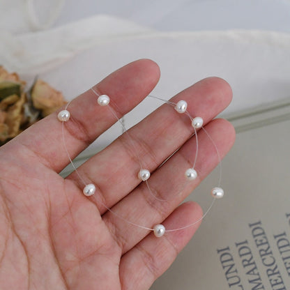 Collier perle fil transparent